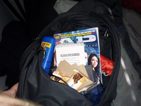 This is what my bag looked like for Warped Tour. I packed CDs and other items to have signed, Pop Tarts, paper and pen, sunscreen, water, my wallet and my ticket.